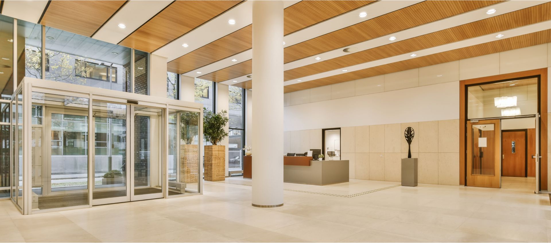 A large lobby with a statue in the middle of it.