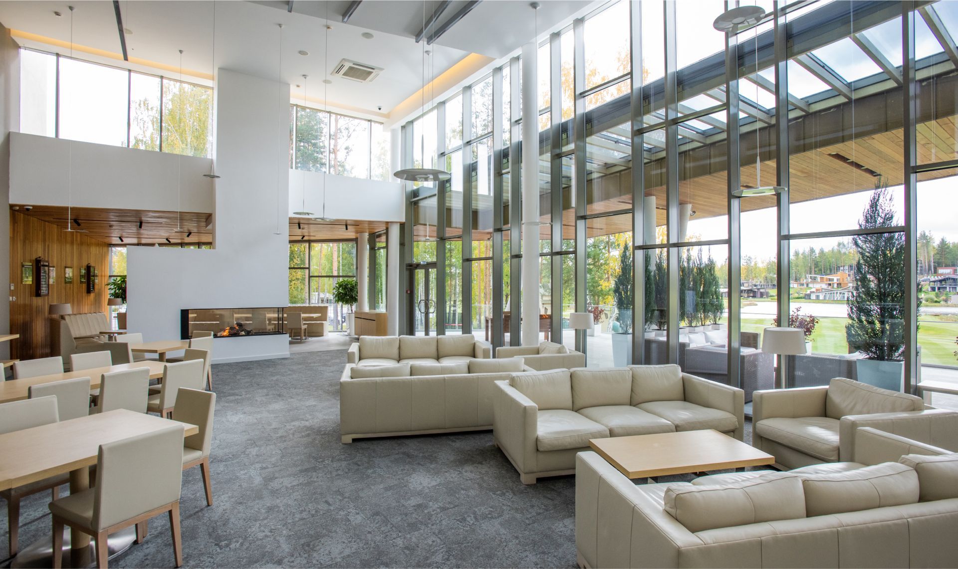 A large living room filled with furniture and tables.