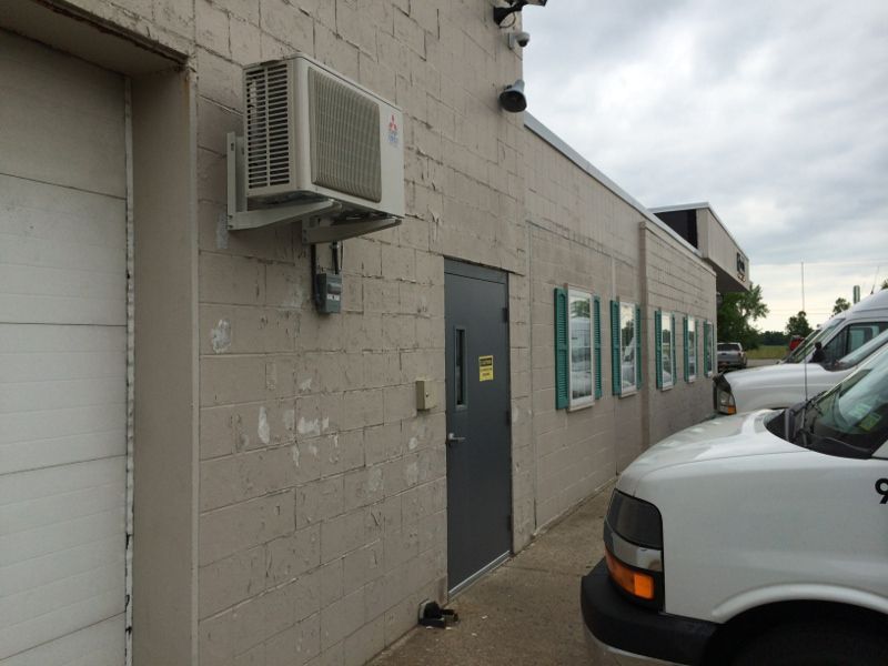 Noco Building with Chipped Paint on Brick