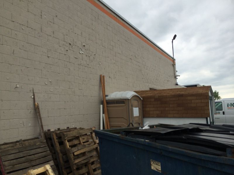 Chipped & Dirty Exterior Paint on Commercial Building