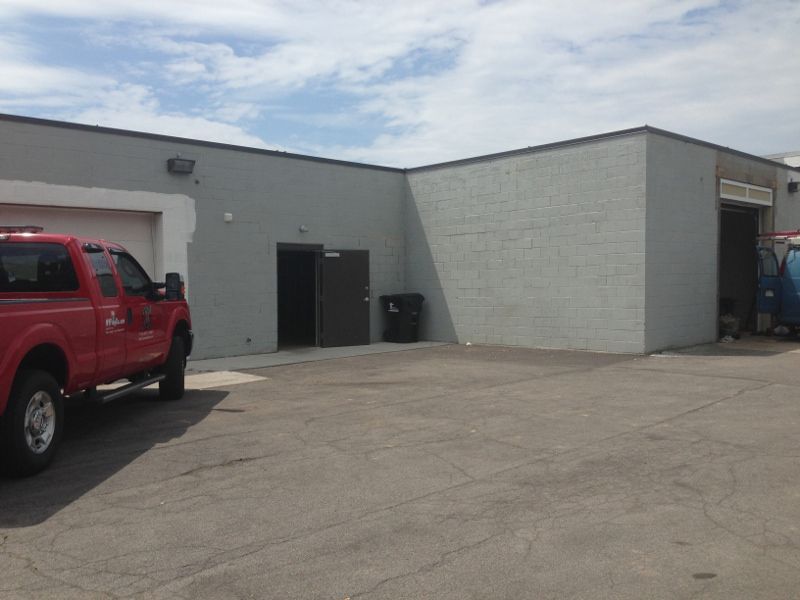 Corner of Building & Entrance Door Before Exterior Painting Project