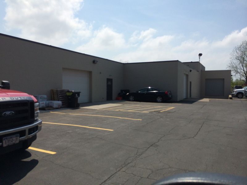 Garage & Entry Door on Side of Building with Fresh Exterior Paint
