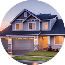 A house with a large garage door is in a circle