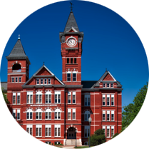 A large red brick building with a clock tower