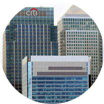 A citi bank building is surrounded by other buildings
