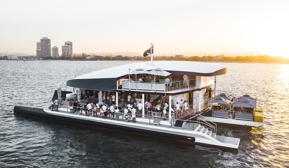 A Large Boat Is Floating on Top of A Body of Water — Club Nautical in Gold Coast, QLD