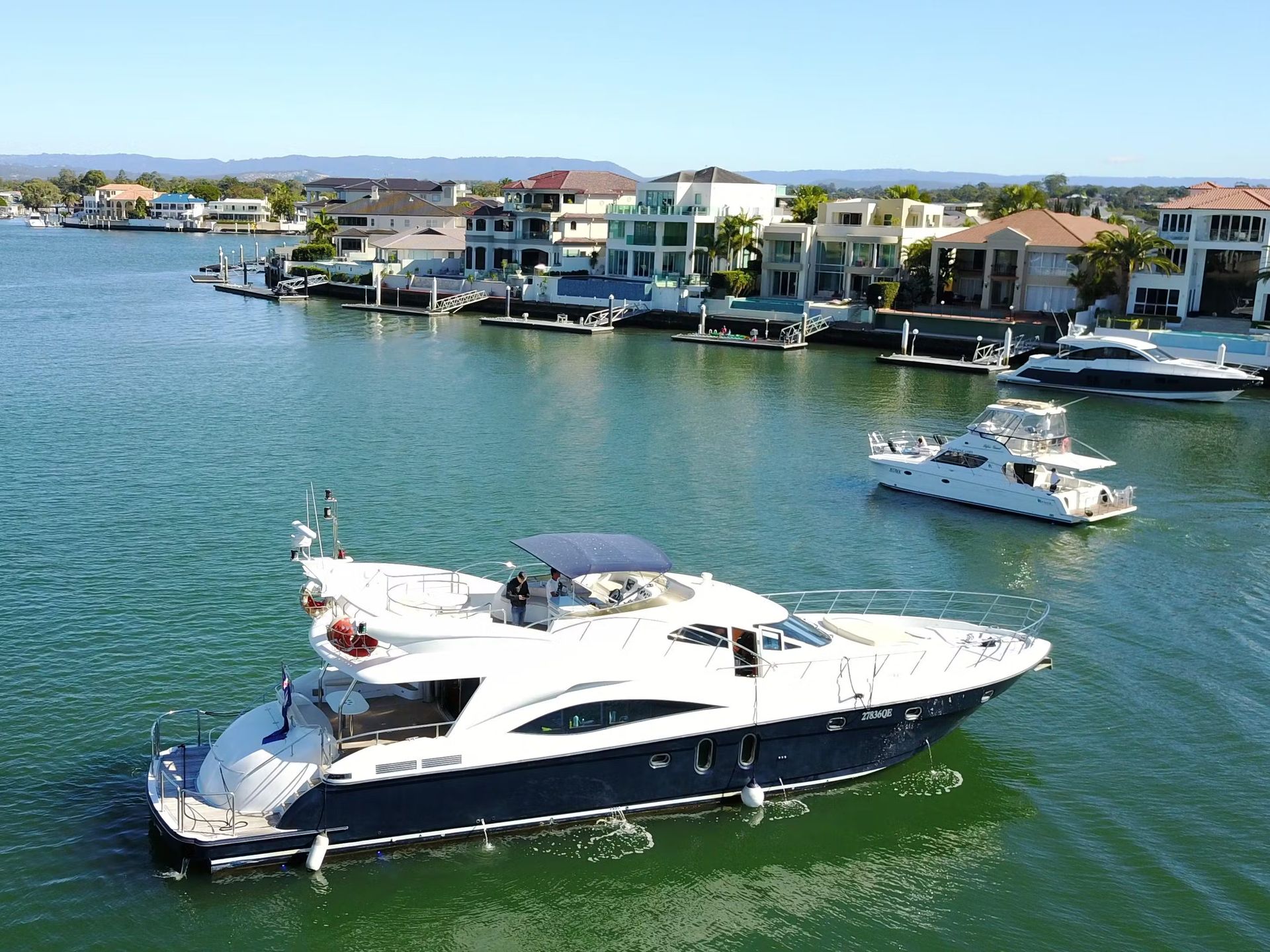 A large yacht is floating on top of a body of water.