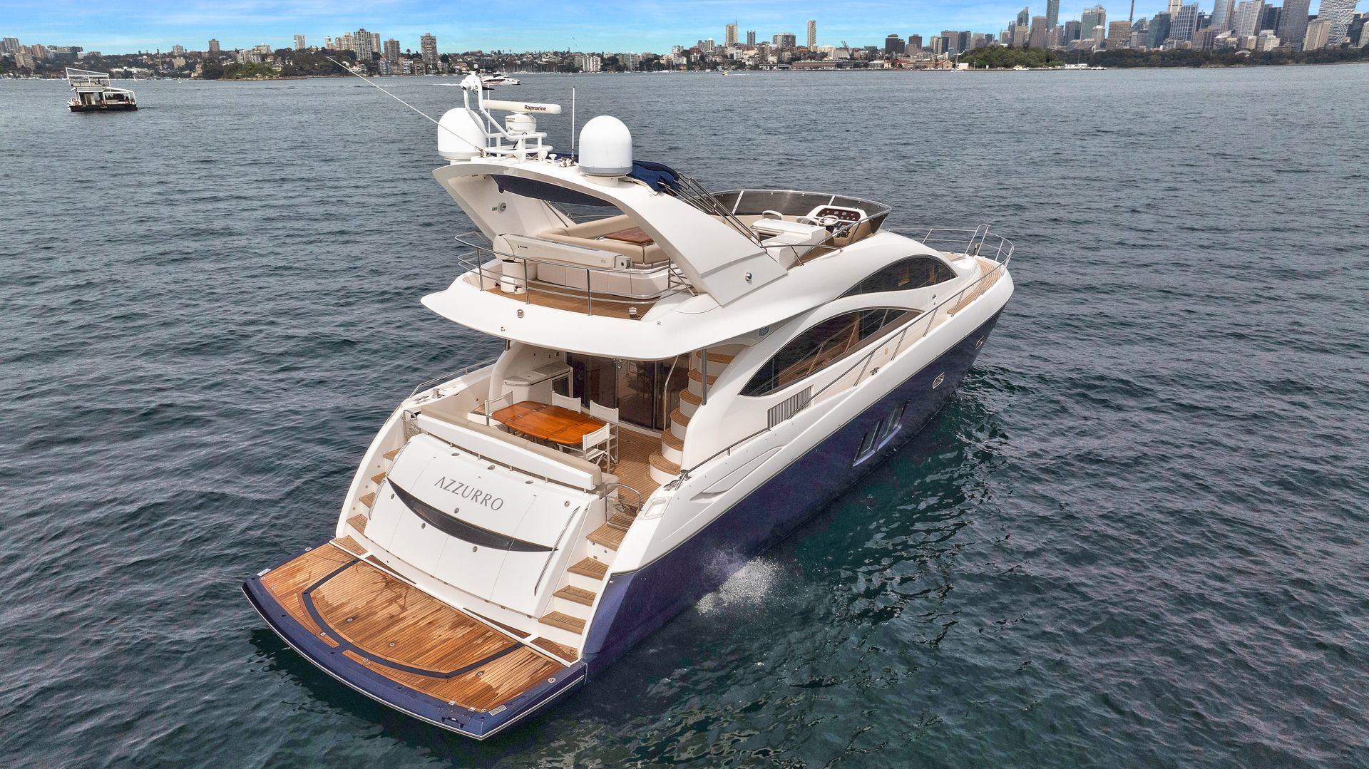 A large yacht is floating on top of a body of water.