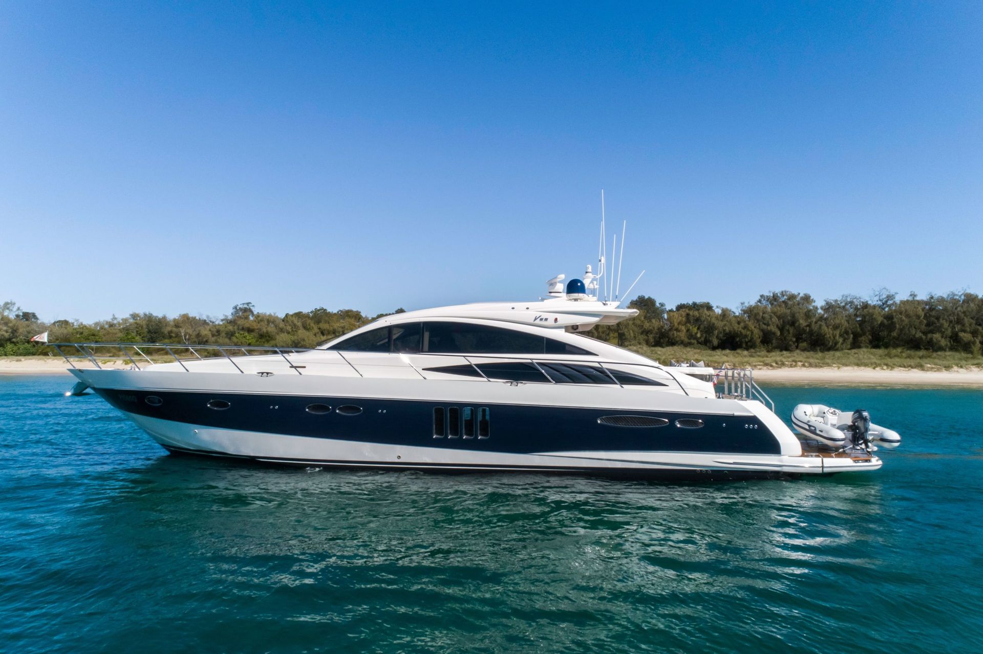 An aerial view of a yacht floating on top of a body of water.