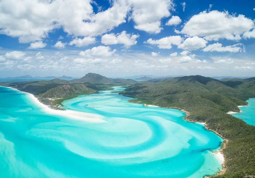 An Aerial View Of A Large Body Of Water Surrounded By Mountains — Club Nautical in Gold Coast, QLD