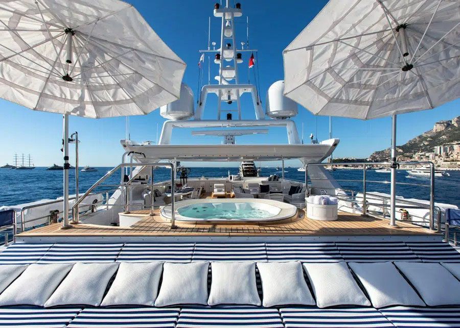 A Yacht with A Jacuzzi and Umbrellas on The Deck — Club Nautical in Gold Coast, QLD