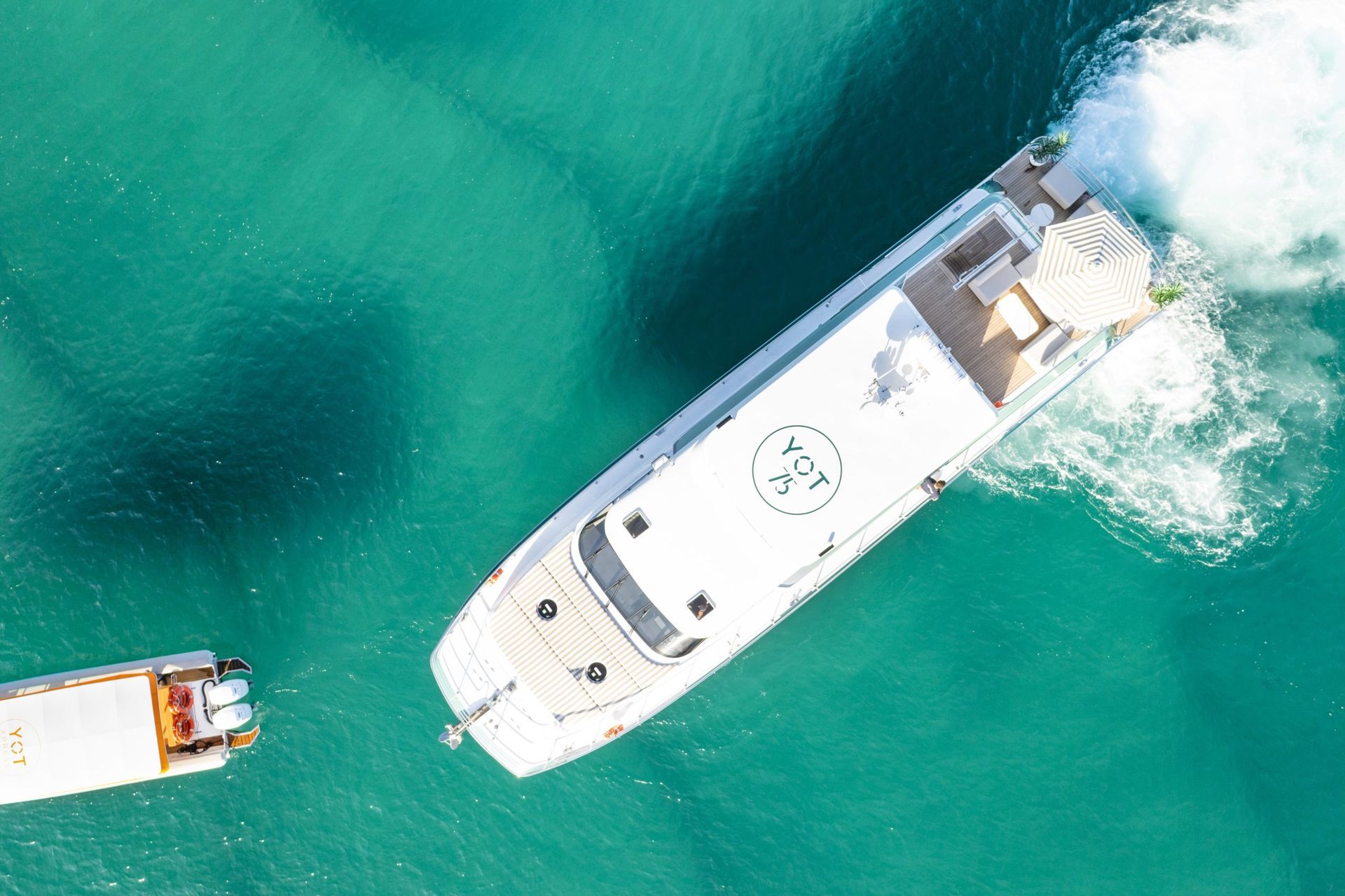 A large boat is floating on top of a body of water.