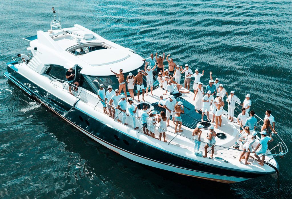 A Large Boat Filled with People Is Floating on Top of A Body of Water — Club Nautical in Gold Coast, QLD