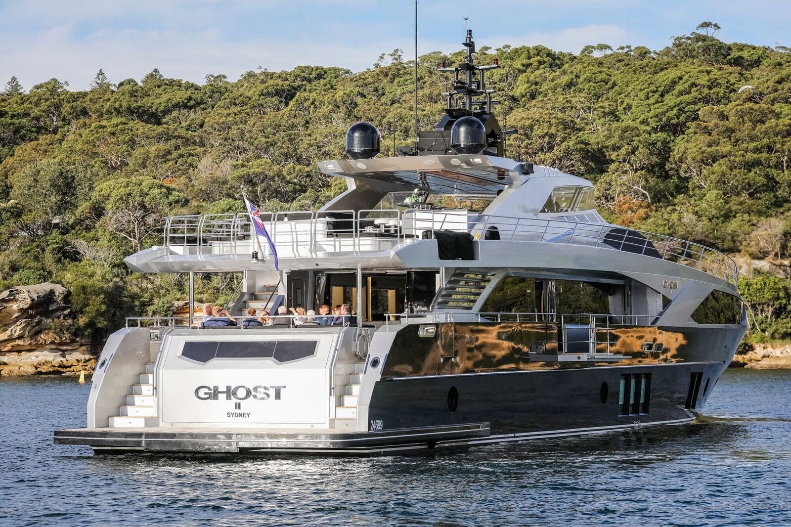 A large yacht is floating on top of a body of water.