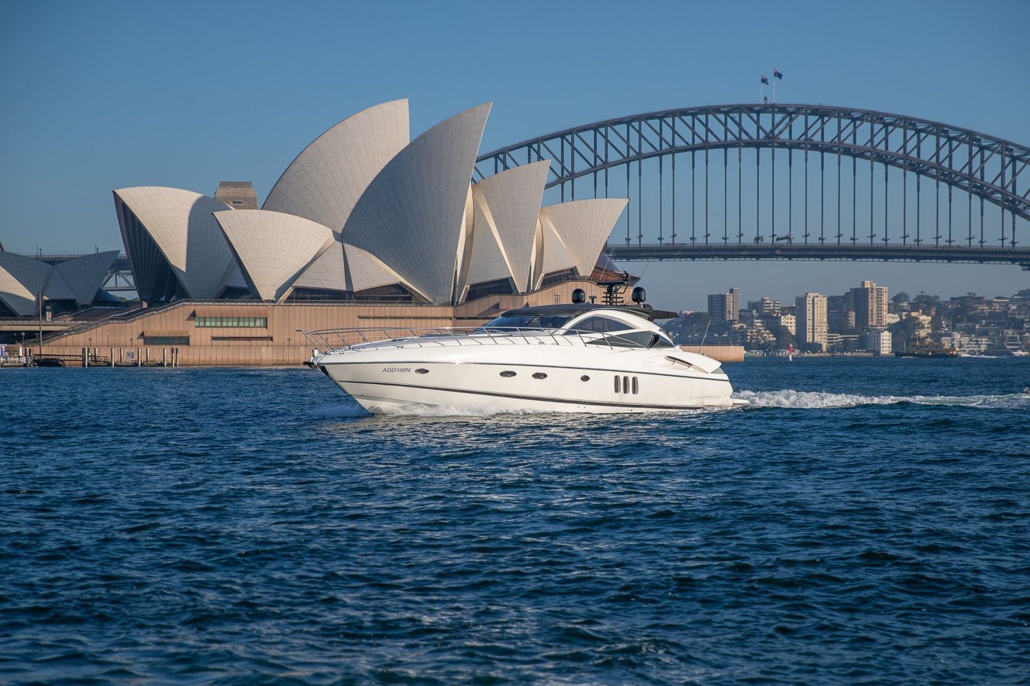A yacht is floating on top of a body of water.