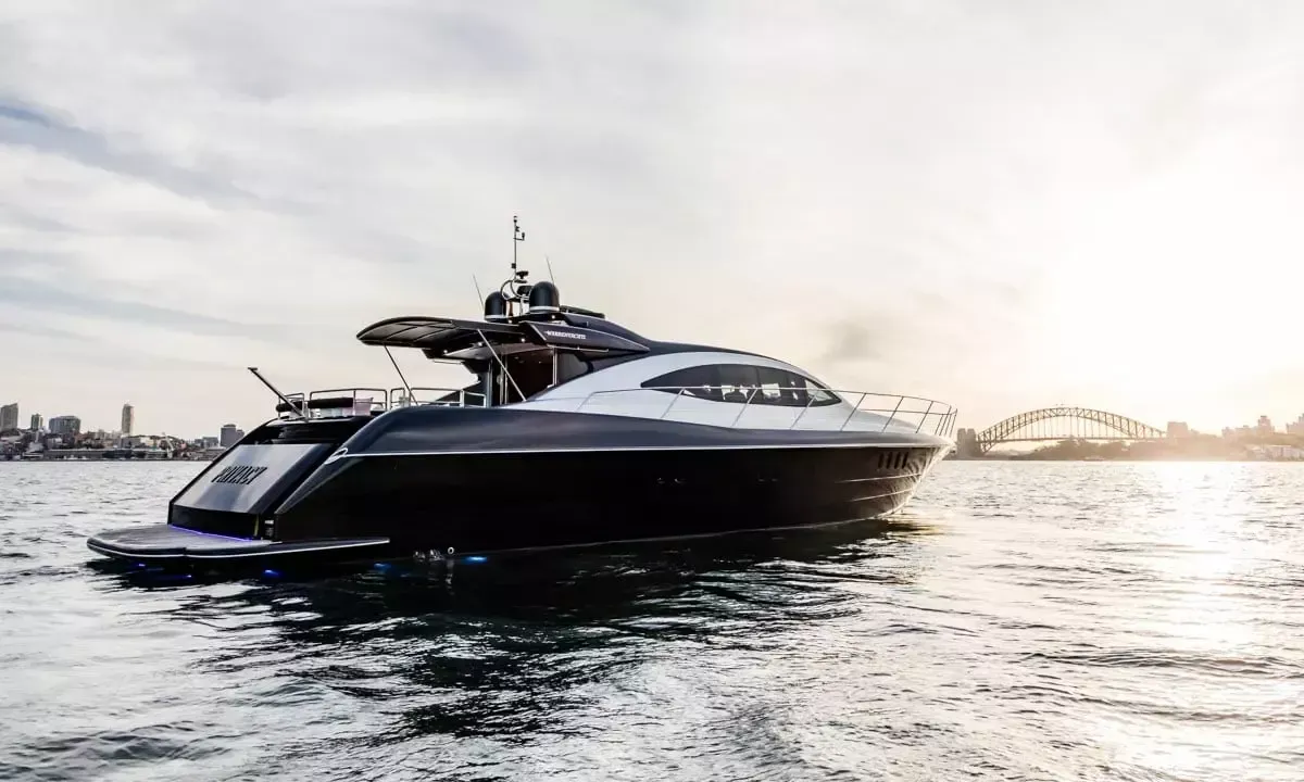 A large yacht is floating on top of a body of water.