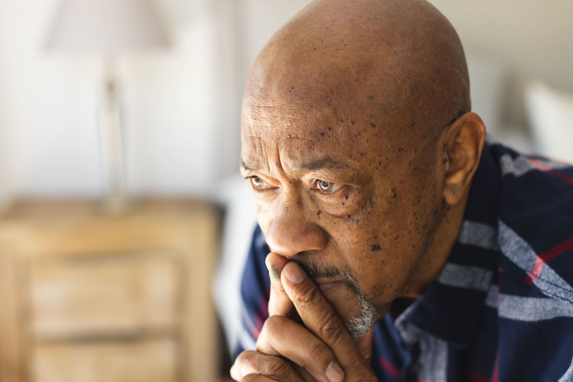 Doctor's hands holding a patient's hands in a gesture of comfort and care.