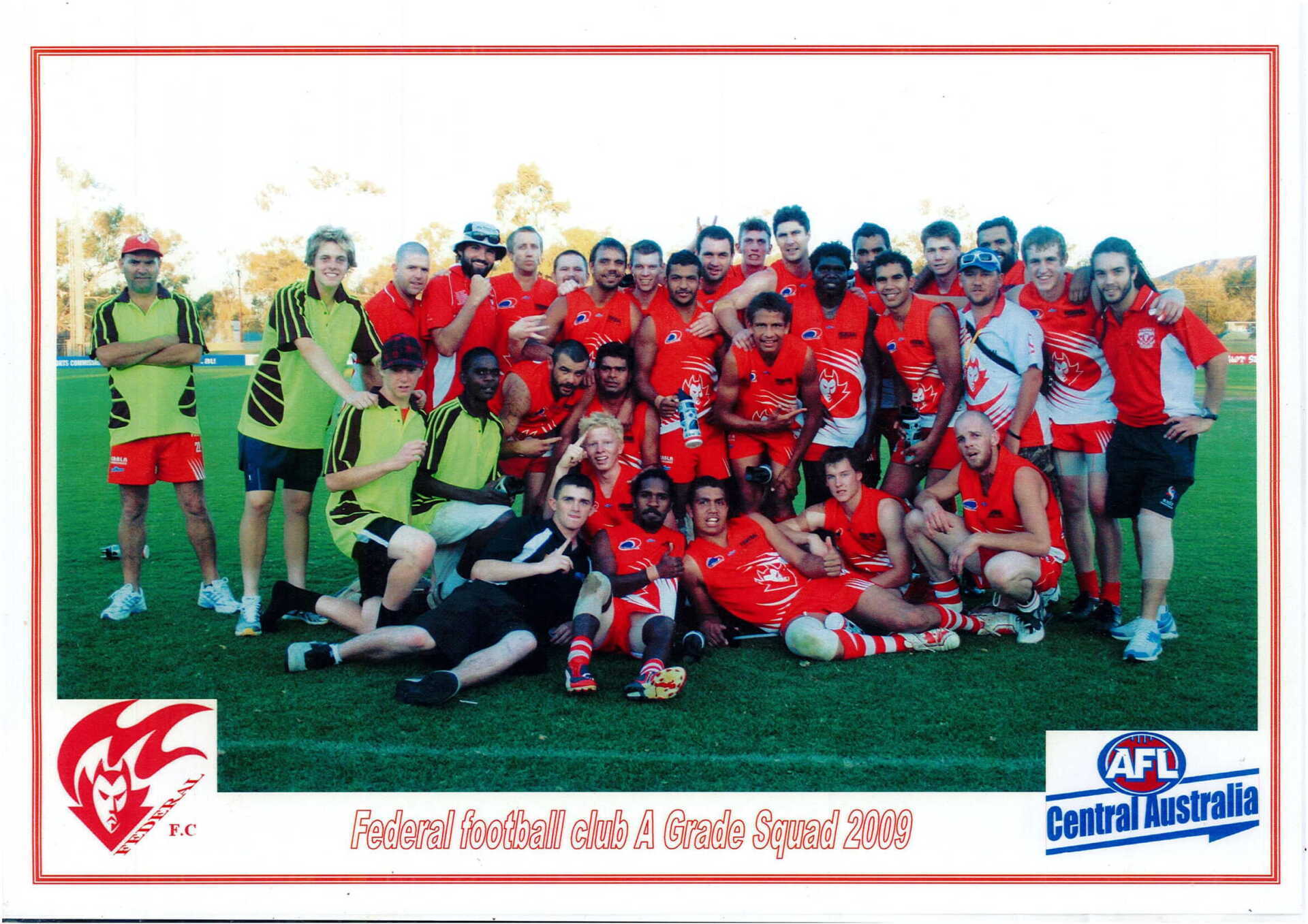 A group of people posing for a picture with the words afl central australia on the bottom
