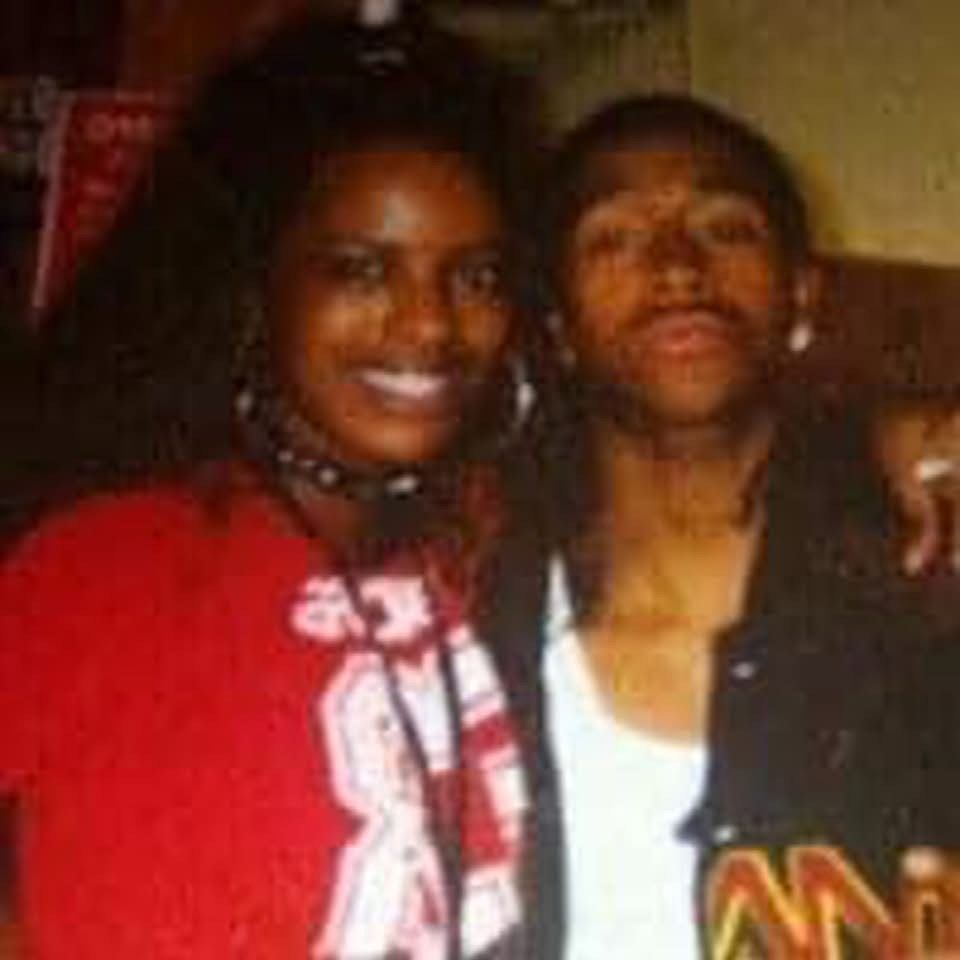 A man and a woman are posing for a picture together.