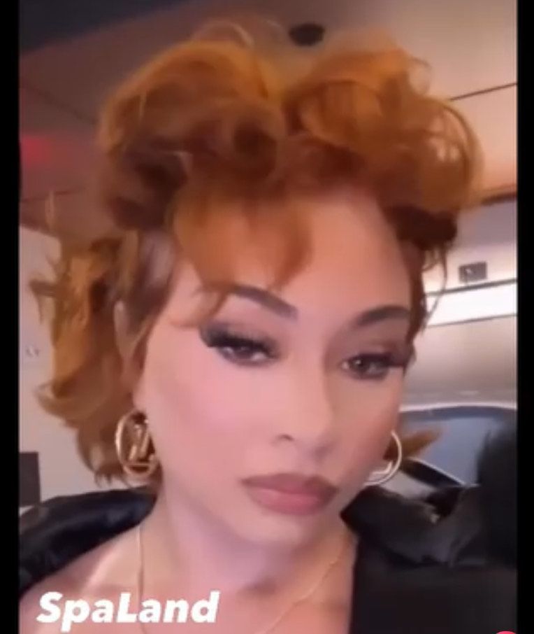 A close up of a woman 's face with spaland written on the bottom