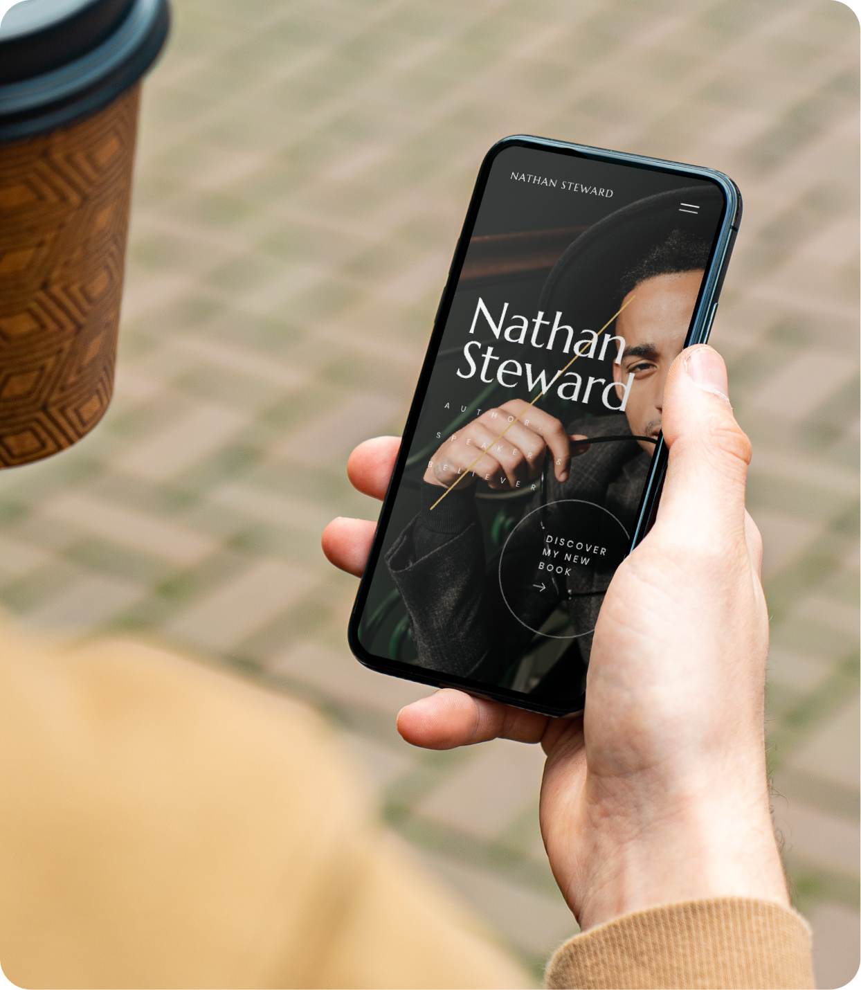 Nathan Steward’s website template displayed on mobile as man hold cellphone