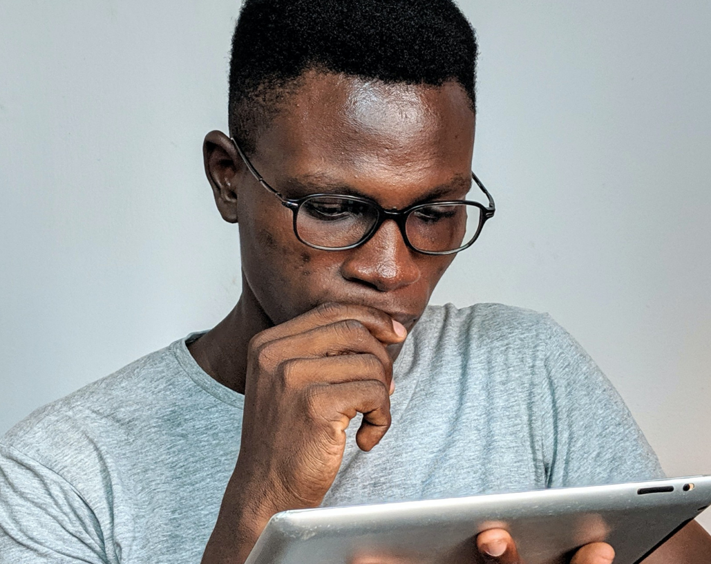 man looking at tablet