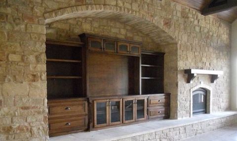 built in entertainment center with a fireplace mantel design and built by JB Murphy Co.