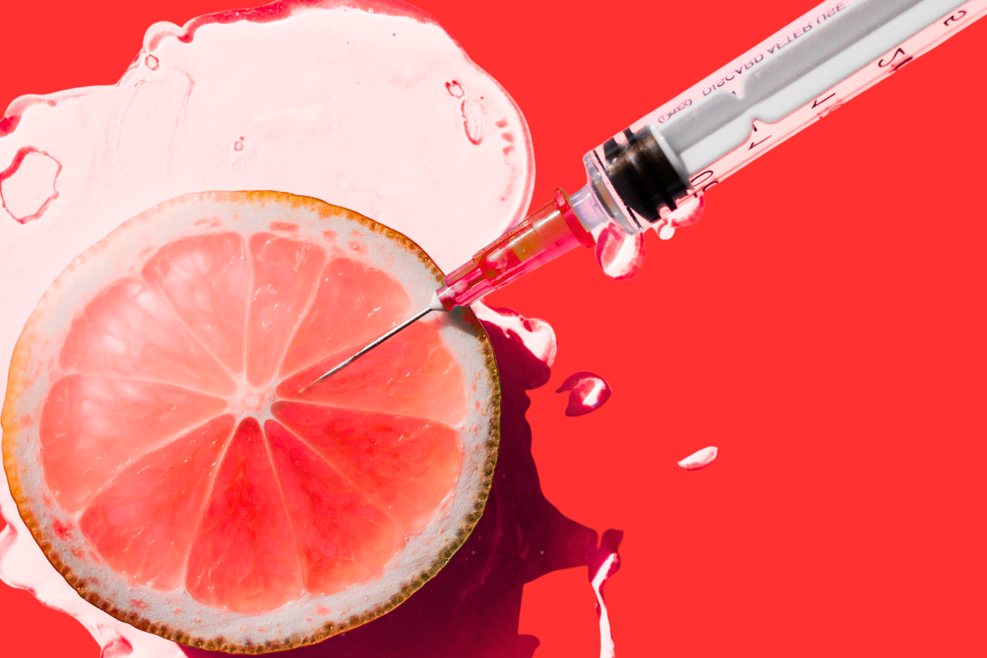 A vitamin shot over a slice of citrus fruit to represent a sense of natural and healthfulness.