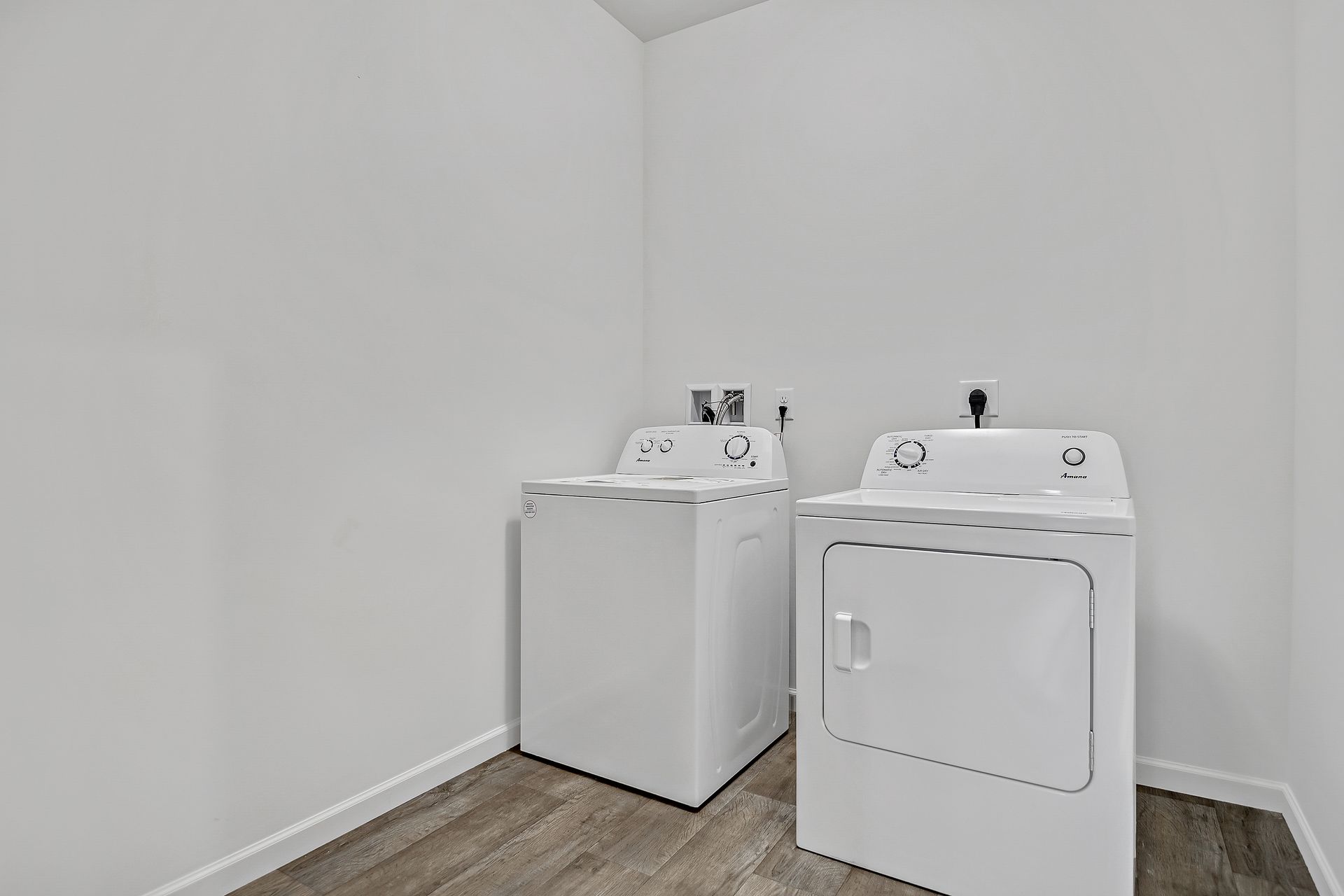 A laundry room with a washer and dryer in it.