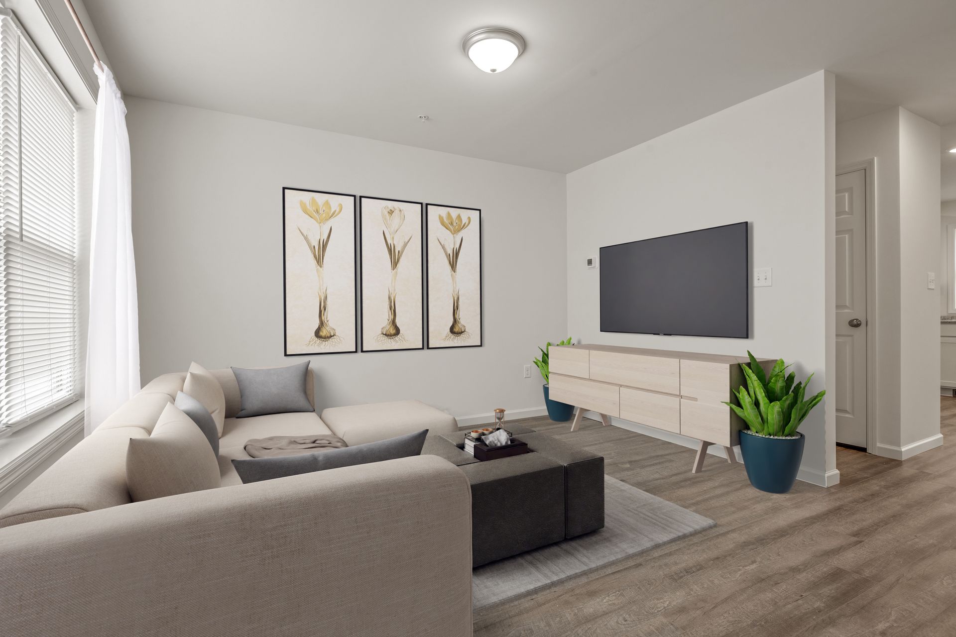 A living room with a couch , table , and television.