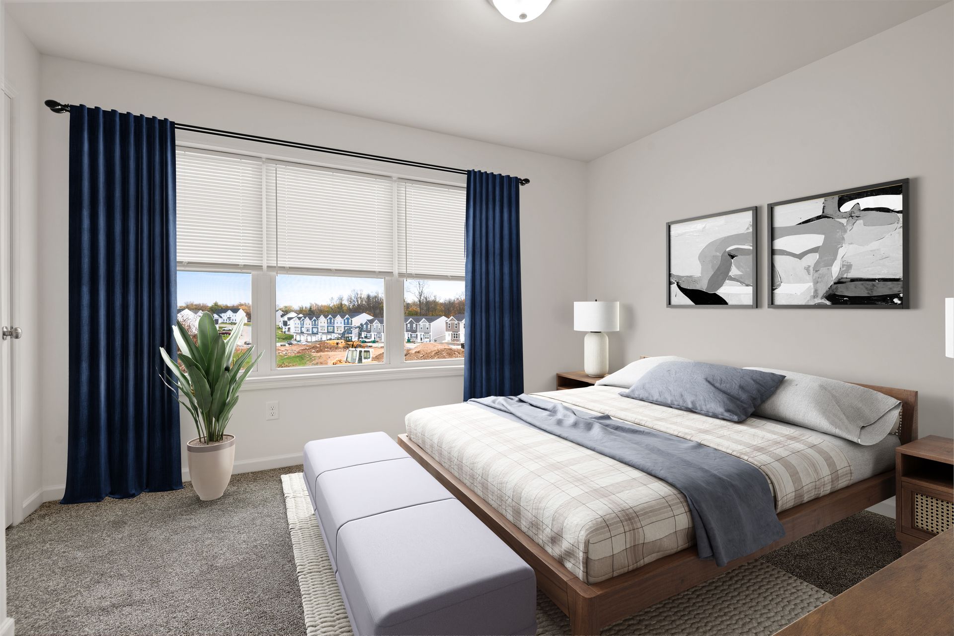 A bedroom with a large bed and a window