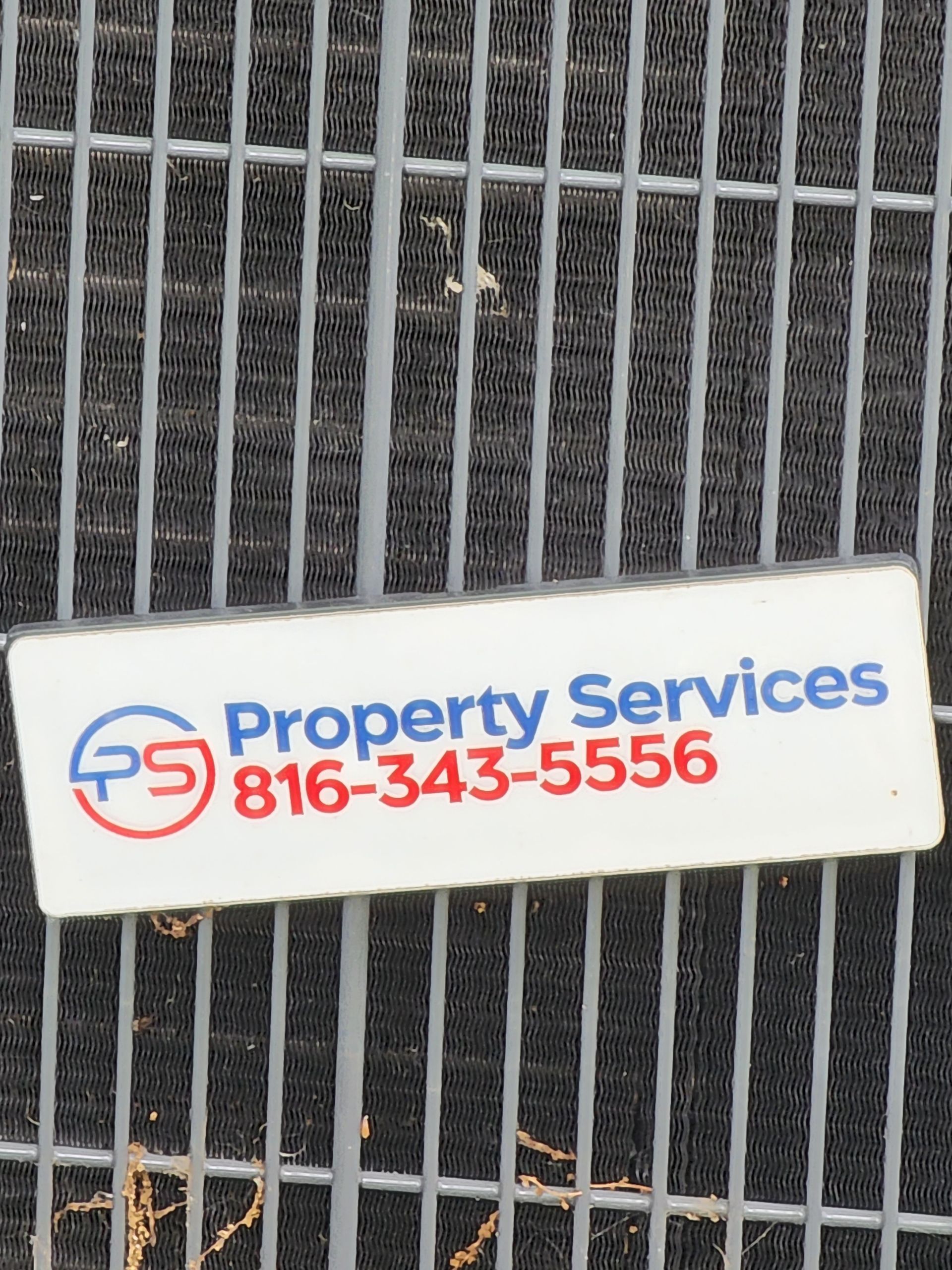 A white label with a blue and red logo reading 