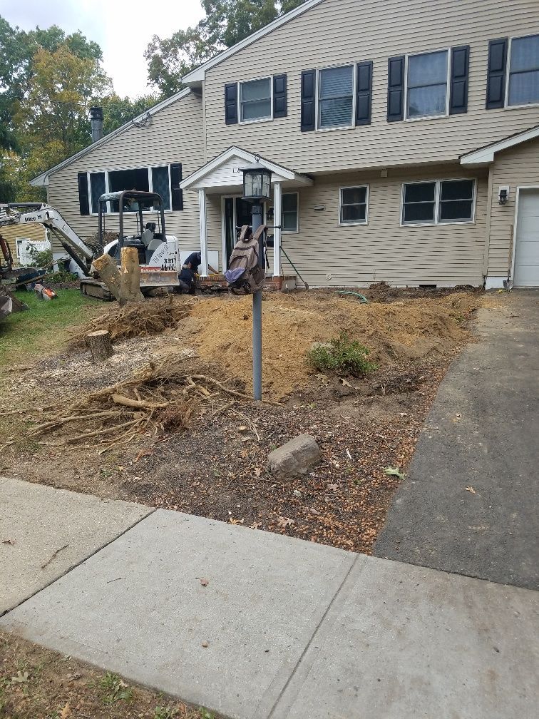 A large house with a lot of dirt in front of it.