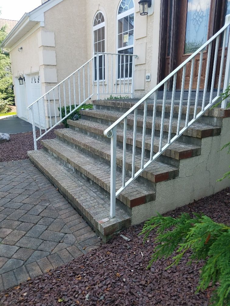 A close up of a brown fence in front of a house.