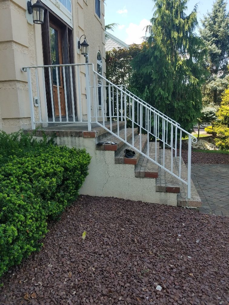 A close up of a brown fence in front of a house.