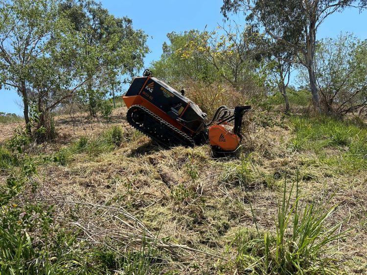 A Tractor is Stuck in the Grass on a Hill — NQ Steep Terrain Mulching and Clearing in The Leap, QLD