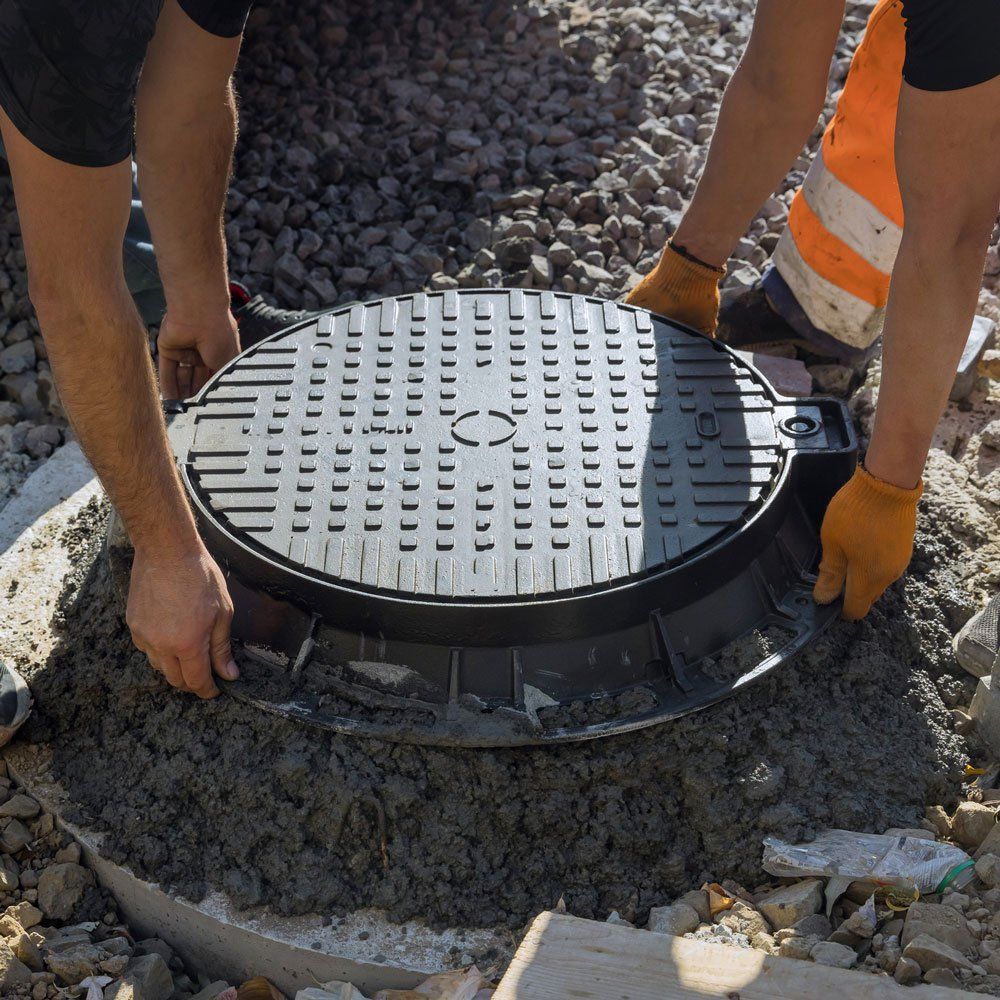 Installing Cast Iron Sewer Hatch — Statesville, NC — Lentz Septic Tank Service