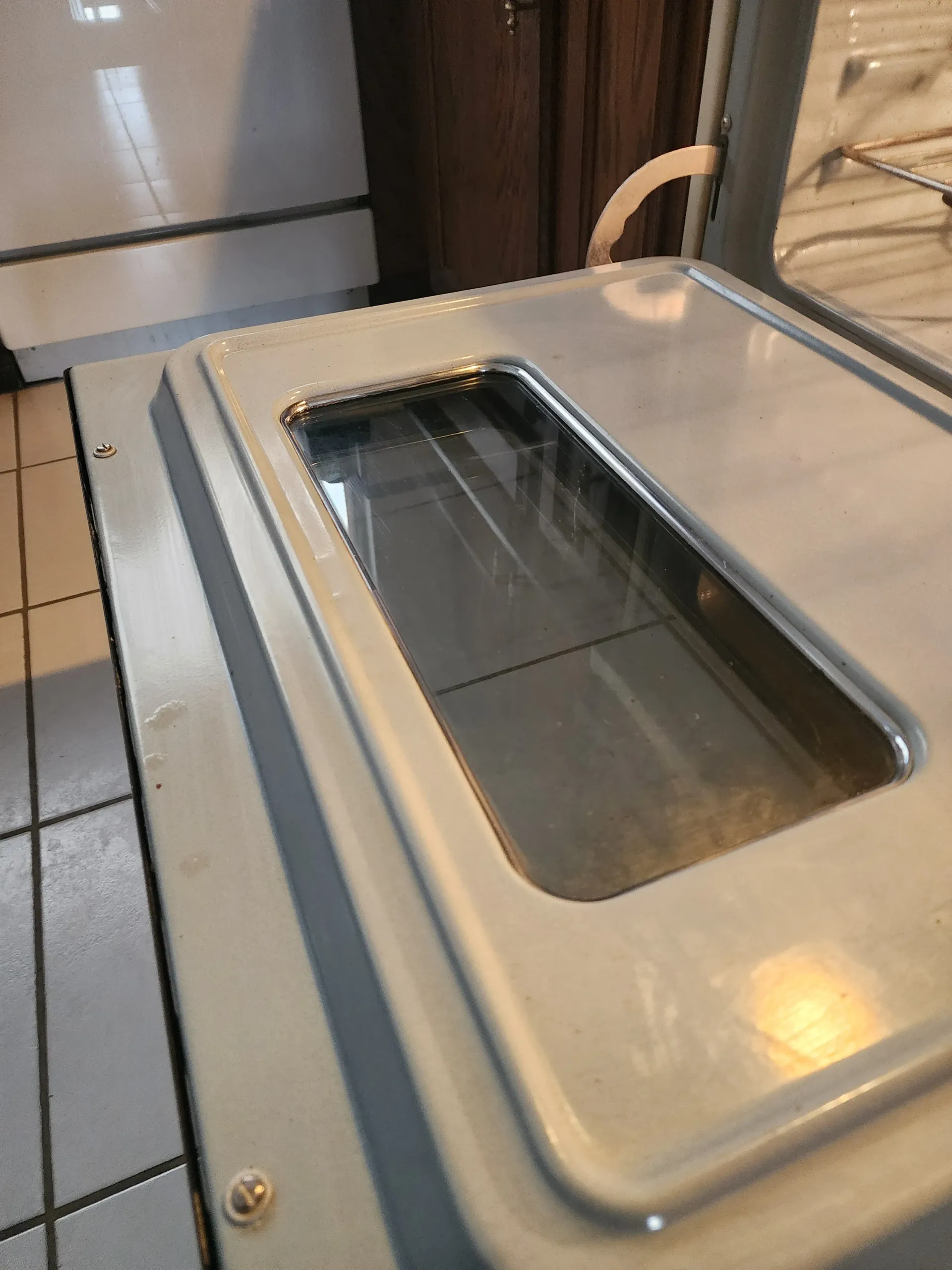 a close up of a stainless steel appliance with a hole in the middle .