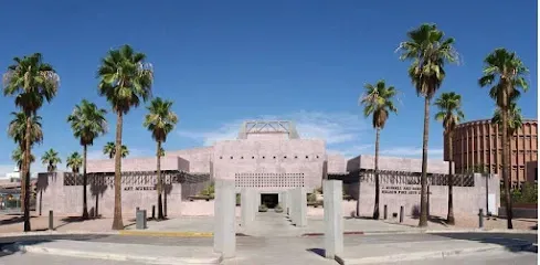 A large building with palm trees in front of it
