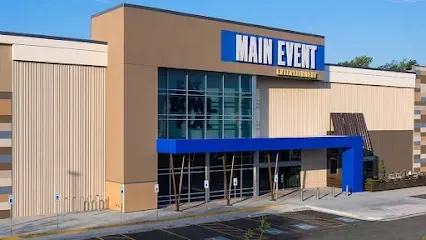 A large building with a blue awning that says main event