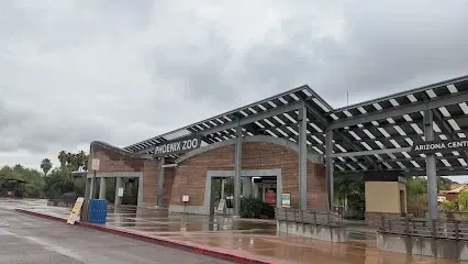 a brick building with a roof that is covered in solar panels .