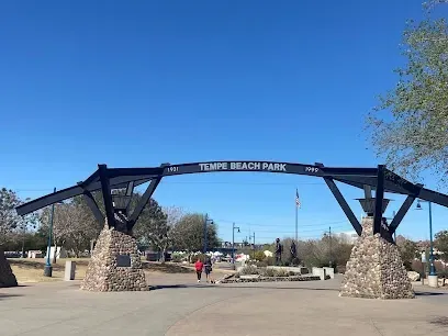 The entrance to tempe beach park is a large archway.