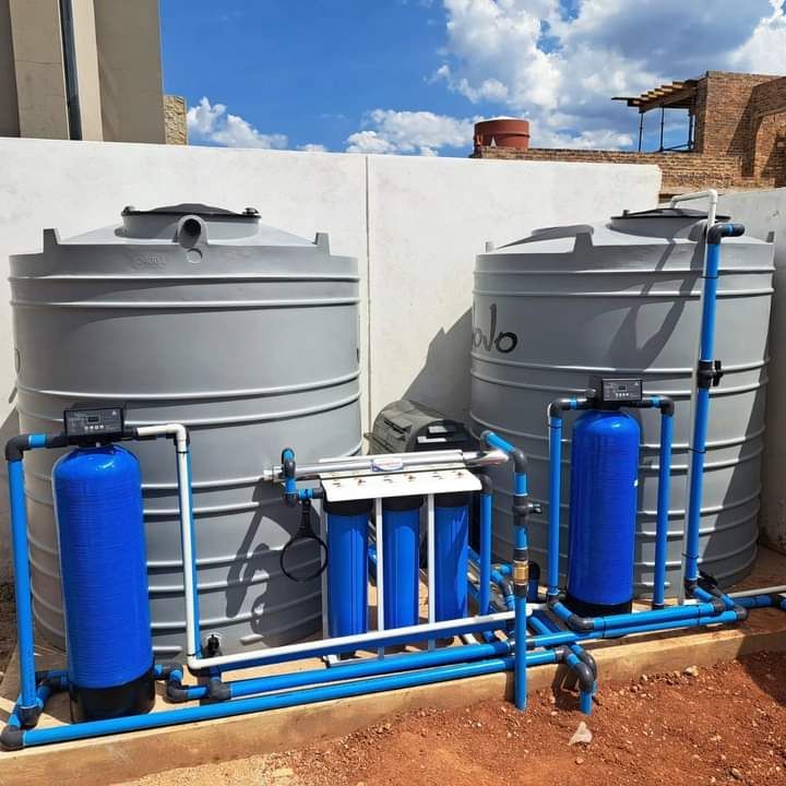 Two grey water tanks connected to filters