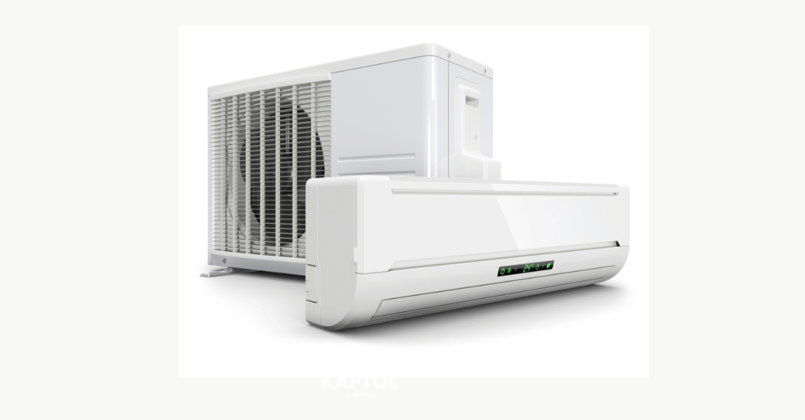 Two white air conditioners are sitting next to each other on a white background.