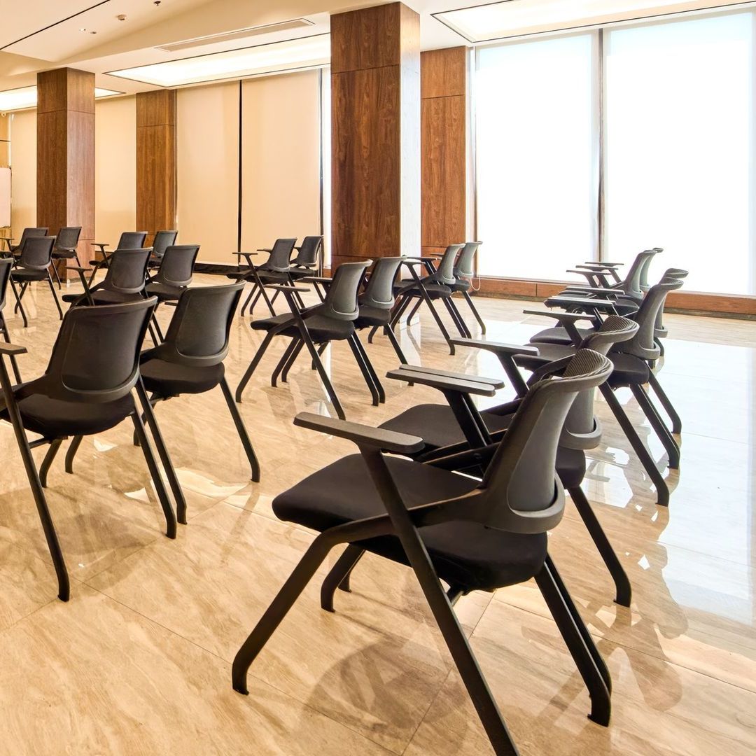 Hotel Casiana's function room with a lot of chairs and tables in it