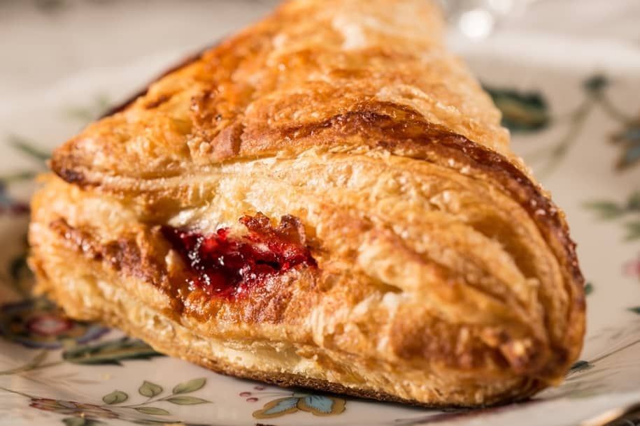 A close up of a pastry on a plate on a table.