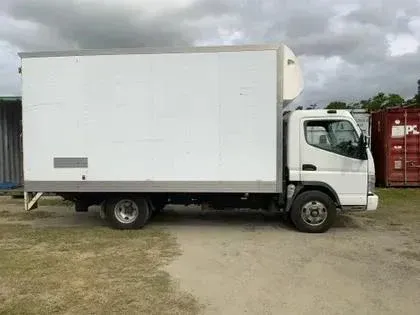 A Worker Loading Boxes From A Truck With A Forklift On Asphalt — Cairns Budget Storage In Mount Sheridan, QLD