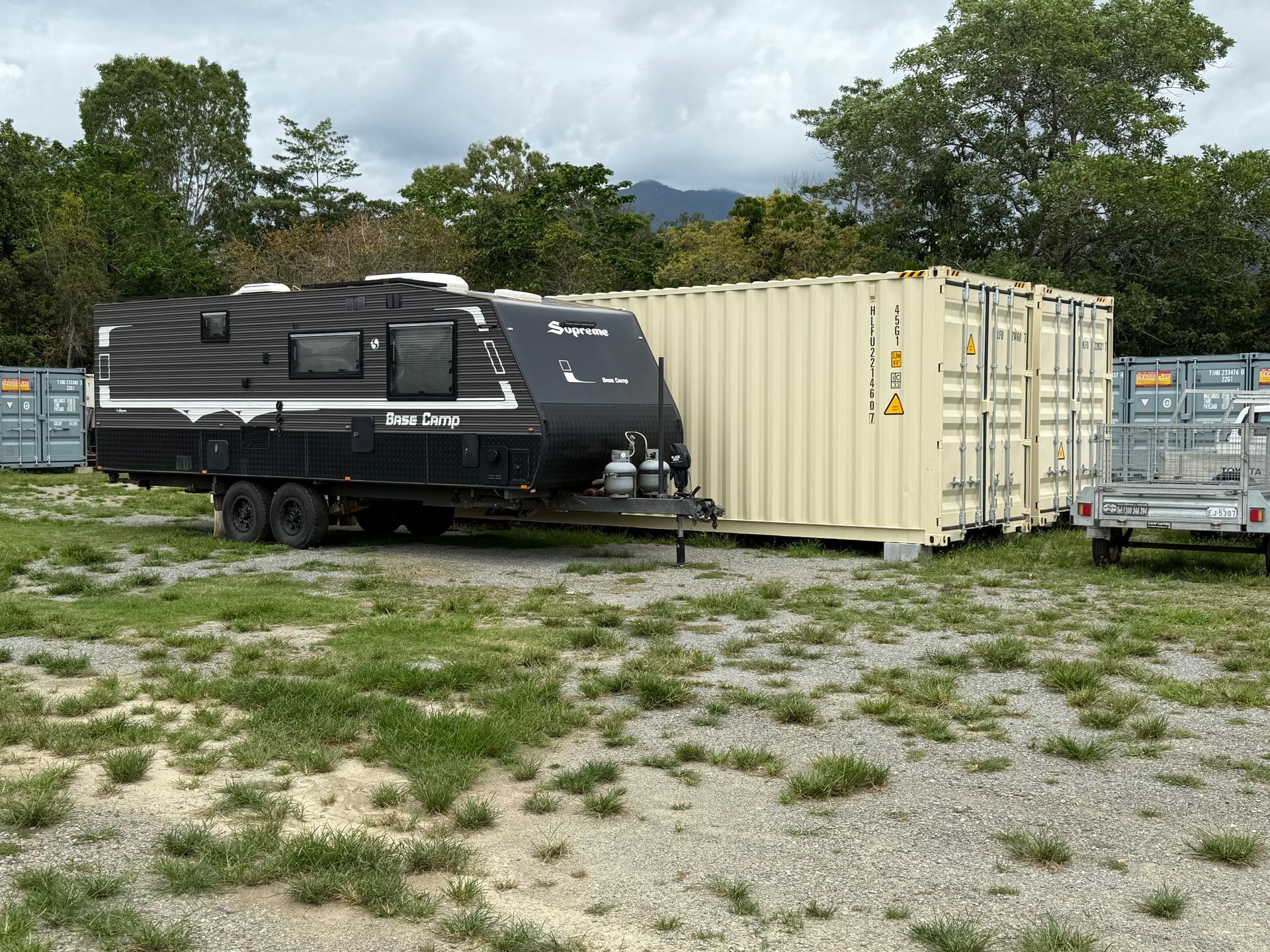 Storage Units With Gray Doors Numbered 2, 3, And 4, Under A Blue Sky — Cairns Budget Storage In Mount Sheridan, QLD
