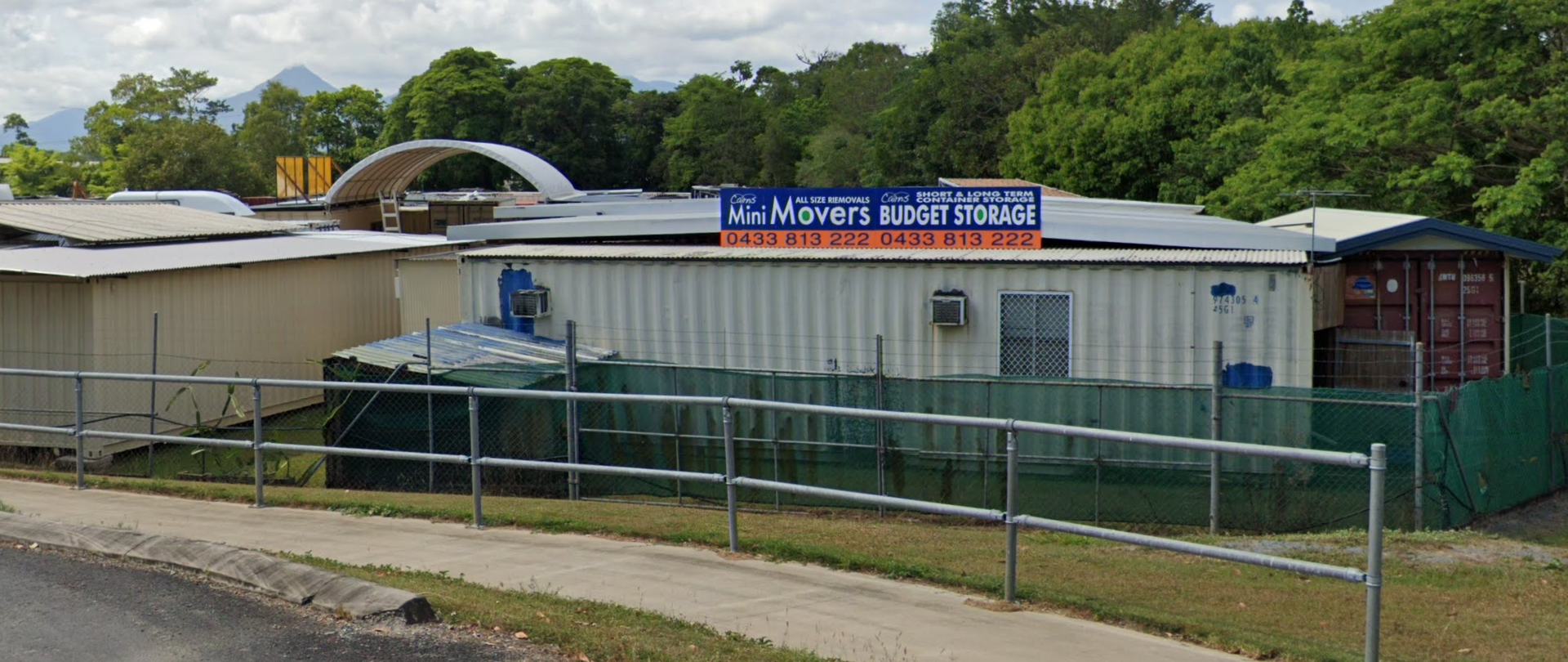 White Delivery Truck With Open Back And Ramp, Parked Near A Building — Cairns Budget Storage In Mount Sheridan, QLD
