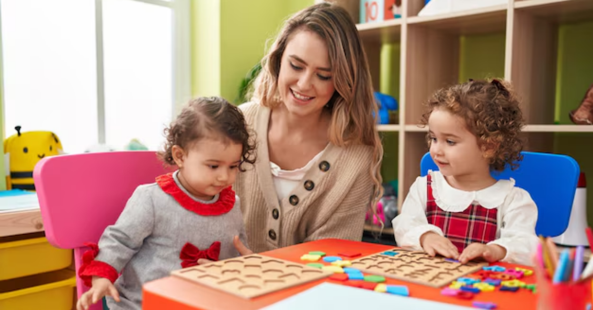 A woman is playing with two little girls at a table.